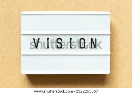 Lightbox with word vision on wood background