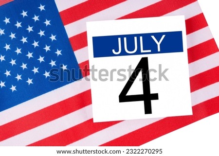 4 th July calendar with part of an American flag on white background.USA Independence Day date. Royalty-Free Stock Photo #2322270295