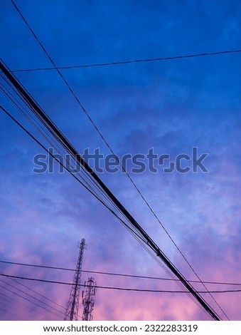 cables, casting towers, and blue skies with a beautiful blend of colors