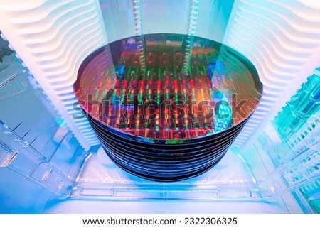 Silicon Wafer Under Cleanroom Fabrication in plastic holder box used in electronics for the fabrication of integrated circuits Royalty-Free Stock Photo #2322306325