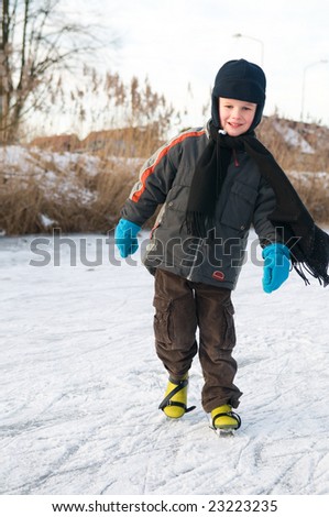Boy ice skating for the first time