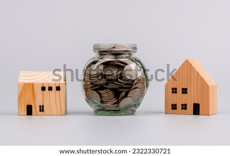 Saving coins in a glass jar saving money to build the future Saving money for business. Income. Salary. Savings concept.