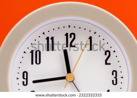 alarm clock time strategy Work plan with time. Orange background. Working with time. Punctuality. Keep time
