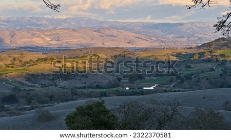 View of Silicon Valley under cloudy sky at sunset.