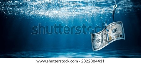 US Currency On Large Hook Under Water - Phishing Scam Concept
 Royalty-Free Stock Photo #2322384411