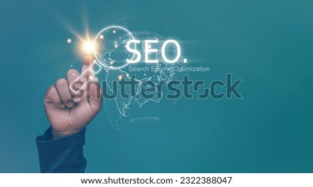 Search Engine optimization (SEO) concept, Businessman using finger pointing to magnifier icon for search information on internet, Surfing the internet to finding information on web browser.