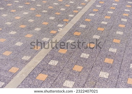 Rough textured paving slab surface with selective focus. Background or backdrop. Design blank or graphic resource