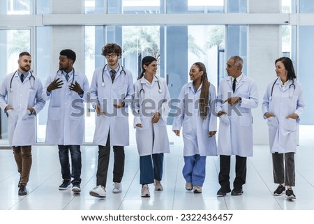 Group of experienced doctors from different of filed working together as primary healthcare team to give medical diagnosis, treatment to patients. Developing positive relationships with colleagues. Royalty-Free Stock Photo #2322436457