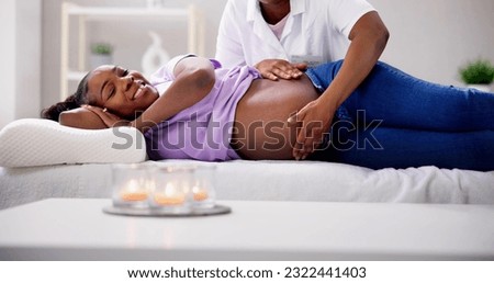 Pregnancy Massage And Physiotherapy By Medical Doctor Royalty-Free Stock Photo #2322441403