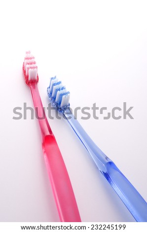 a couple of toothbrush on white background