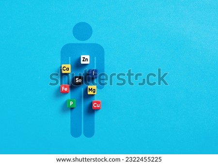 Essential minerals for body and health. Health care concept. Mineral symbols on colorful cubes over a human body symbol. Royalty-Free Stock Photo #2322455225
