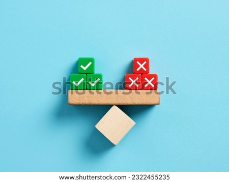 Right and wrong balance. Positive or negative decision making or choice of approval or rejection. Checkmark and cross symbols on balance on a scale seesaw. Royalty-Free Stock Photo #2322455235