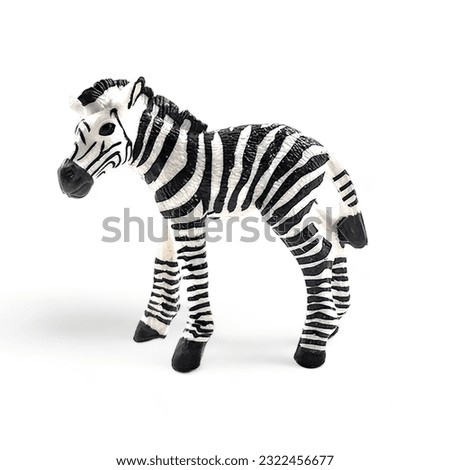 Zebra cub miniature animal toy isolated on white