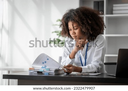African American Business woman hard working, debtor, deferred debt, Times Interest Earned, Subsidiary Ledger, Special Journal, Shareholders Equity, Scrap value, Price Index, Profitability Ratios Royalty-Free Stock Photo #2322479907