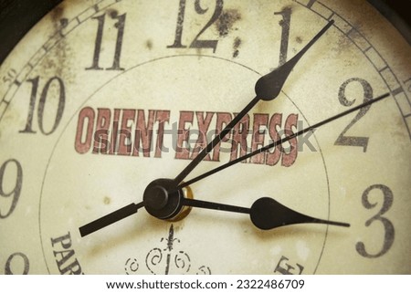 Orient express travel concept with an old watch with the writing on the dial Royalty-Free Stock Photo #2322486709