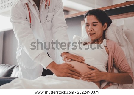 Concept Prenatal care and pregnancy. Doctor examine pregnant healthcare check up for baby and mother at hospital or clinic. Pregnant woman is happy visit gynecologist for pregnancy consultant. Royalty-Free Stock Photo #2322490379