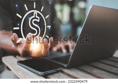 technology, laptop, information, business, data, chart, invest, growth, dashboard, currency. typing keyboard and another hand is catching currency symbol. invest has high risk be careful before use it
