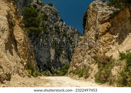 Pass del Comptador, the pass between Sella and Guadalest, small gravel mountain road used by cyclists, Costa Blanca, Alicante, Spain  - stock photo