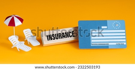 European health insurance card, EU document confirming the right to treatment in EU and EFTA countries, travel insurance for Europeans, concept, health and safe holidays, yellow background, panorama Royalty-Free Stock Photo #2322503193