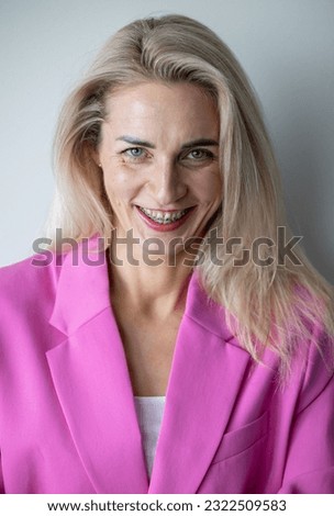 Cheerful business girl with pink weight