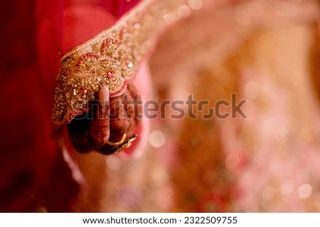 bride wearing bangles hand closeup bride getting ready for wedding ceremony Royalty-Free Stock Photo #2322509755