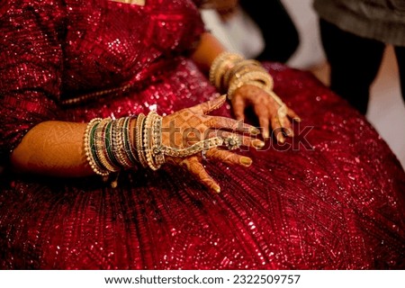 bride wearing bangles hand closeup bride getting ready for wedding ceremony Royalty-Free Stock Photo #2322509757
