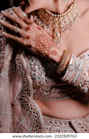 bride wearing bangles hand closeup bride getting ready for wedding ceremony Royalty-Free Stock Photo #2322509763