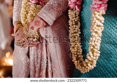 bride wearing bangles hand closeup bride getting ready for wedding ceremony Royalty-Free Stock Photo #2322509771