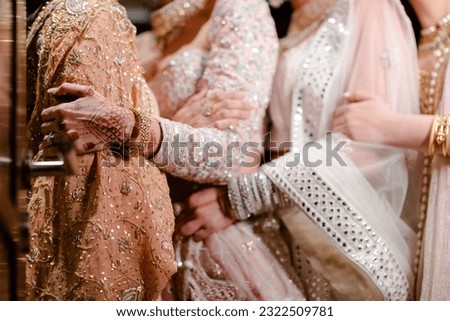 bride wearing bangles hand closeup bride getting ready for wedding ceremony Royalty-Free Stock Photo #2322509781