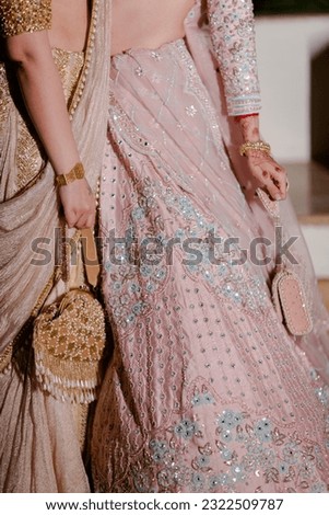 bride wearing bangles hand closeup bride getting ready for wedding ceremony Royalty-Free Stock Photo #2322509787