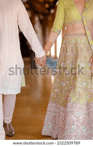 bride wearing bangles hand closeup bride getting ready for wedding ceremony Royalty-Free Stock Photo #2322509789