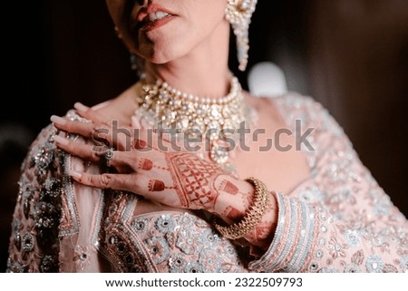 bride wearing bangles hand closeup bride getting ready for wedding ceremony Royalty-Free Stock Photo #2322509793