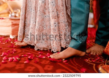 bride wearing bangles hand closeup bride getting ready for wedding ceremony Royalty-Free Stock Photo #2322509795