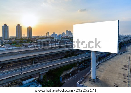 Blank billboard at twilight for advertisement. Royalty-Free Stock Photo #232252171