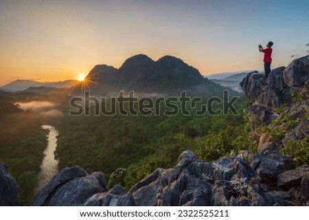 Capturing the beauty of nature in the morning with a beautiful sunrise on the Langara Loksado hill, South Kalimantan Royalty-Free Stock Photo #2322525211