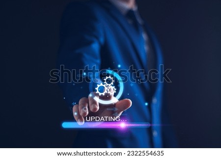Operating system upgrade concept, installation app and software update process, modernize user equipment, update modern functions, developer released new version Improved security. User is downloading Royalty-Free Stock Photo #2322554635