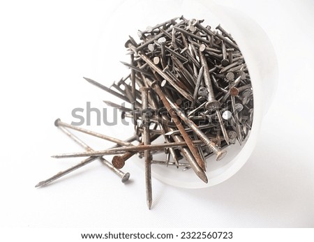 Rusty nails in a plastic box

