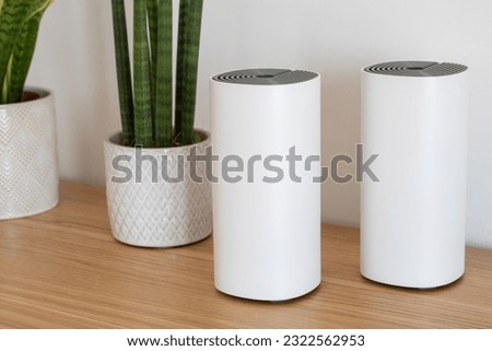 Wifi mesh router and satellite system Royalty-Free Stock Photo #2322562953