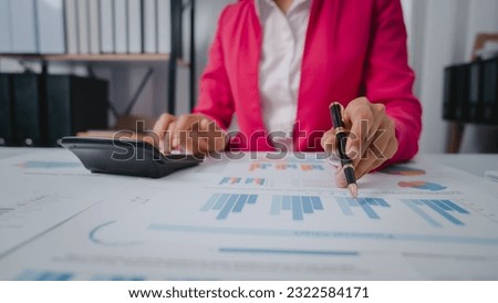 Excited Asian bookkeepers doing bookkeeping, accounts payable, assets, book value, equity, inventory, liabilities, cost of goods sold, depreciation, expenses, Gross profit, diversification, liquidity Royalty-Free Stock Photo #2322584171