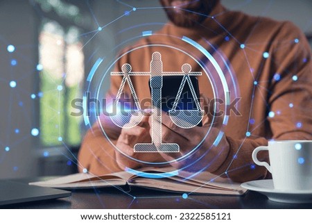 Man read, send text message from phone. Holding using smartphone typing at office workplace with notebook. Concept of distant work, business education. Legal and law icons