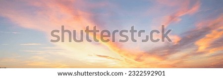 sky sunset with blue sky and pastel colored clouds Royalty-Free Stock Photo #2322592901