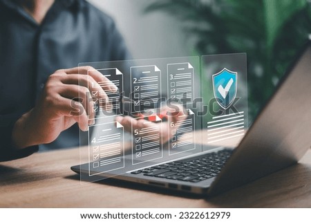Standards quality control assurance warranty business technology concept, Businessman  check the terms and conditions of the quality guarantee of the product and car warranty list with laptop Royalty-Free Stock Photo #2322612979