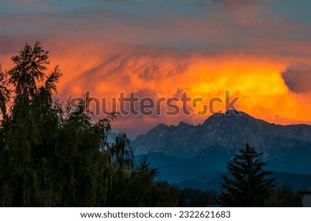 Sunset over the mountain with thunder clouds before storm approaching