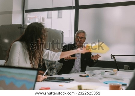 Close up of business woman throwing paper  at the business meeting