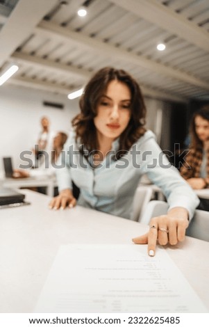 Gorgeous brunette girl reading a question from the test