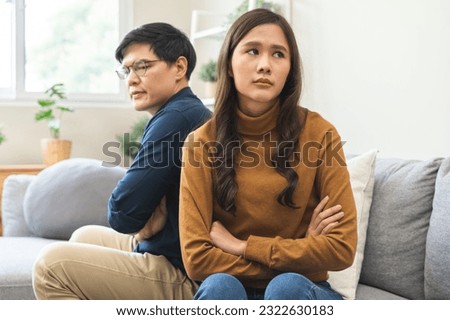 Breakup and depressed, asian young quarrel couple love fight relationship in trouble. Different people are emotion angry. Argue wife has expression upset with husband. Problem of family people. Royalty-Free Stock Photo #2322630183