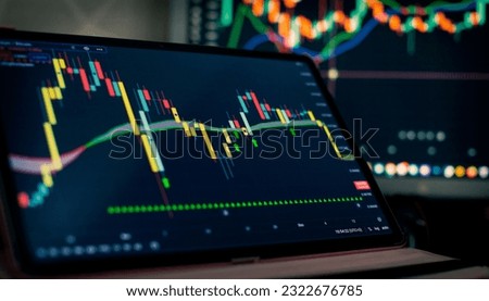 Technical price graph and indicator, red and green candlestick chart on blue theme screen, market volatility Royalty-Free Stock Photo #2322676785