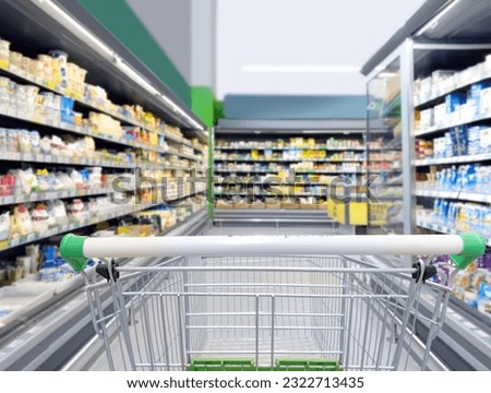 Choosing food from shelf in supermarket,vegetables in grocery section,Grocery stores  Royalty-Free Stock Photo #2322713435
