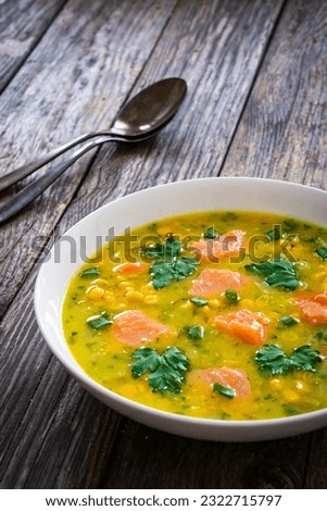 Chowder - American style fish soup on wooden table 