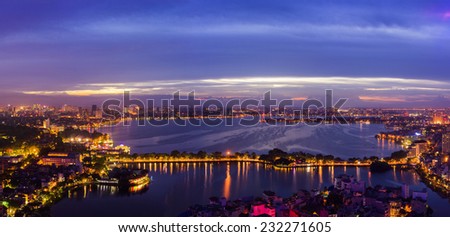 Hanoi City panorama skyline with urban skyscrapers at West Lake at sunset 